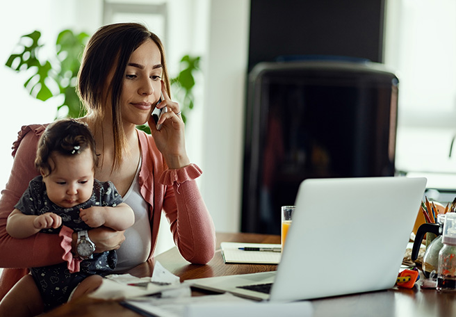woman withh baby at home on the phone